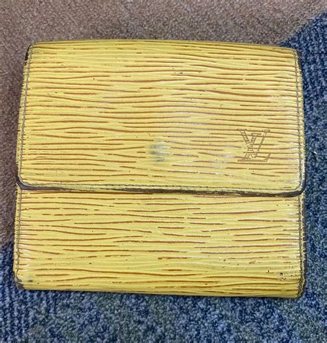 wallet repair louis vuitton